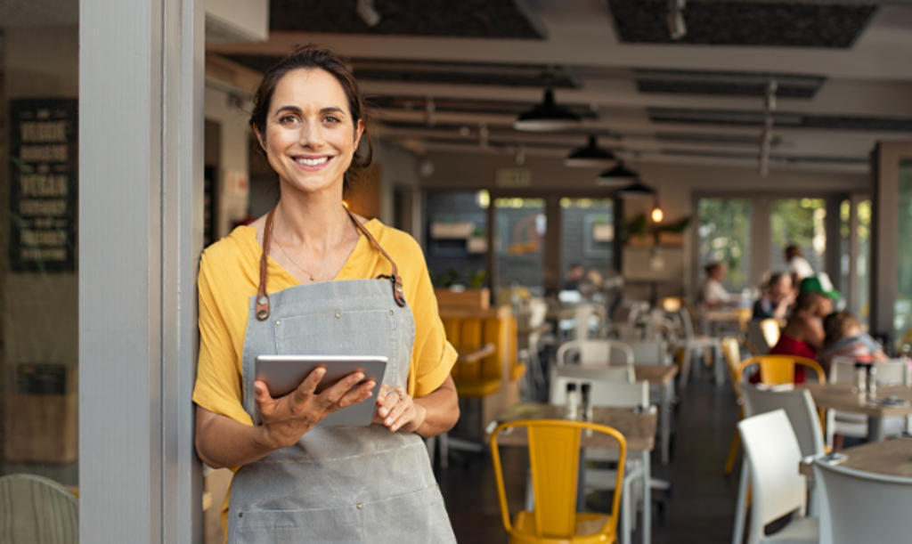 business savings girl with ipad at resturaunt