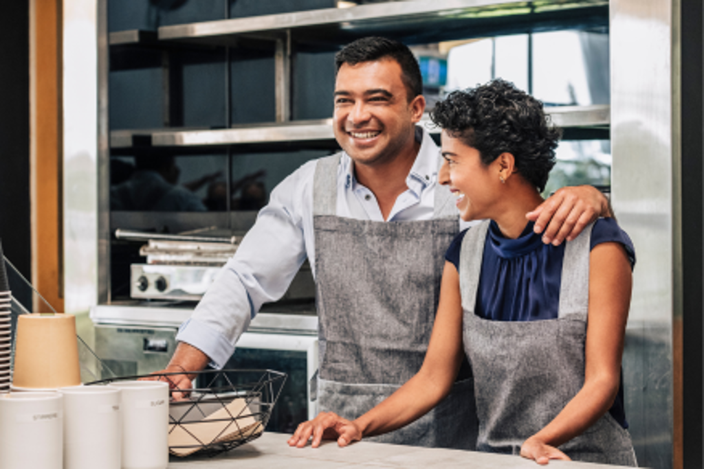 husband and wife at bakery working