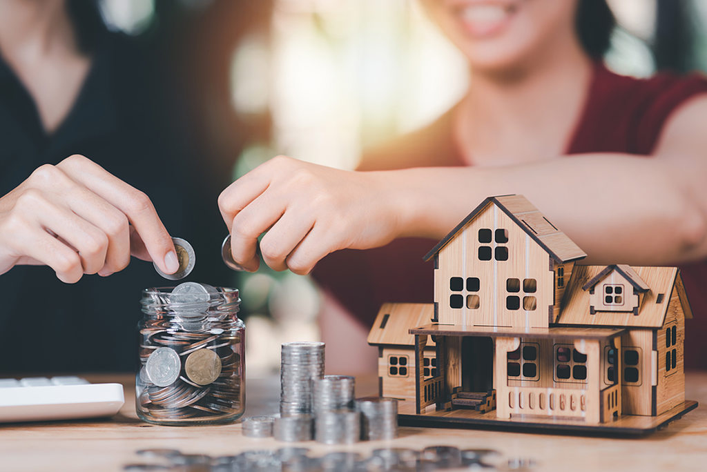 small wooden house snd silver coins