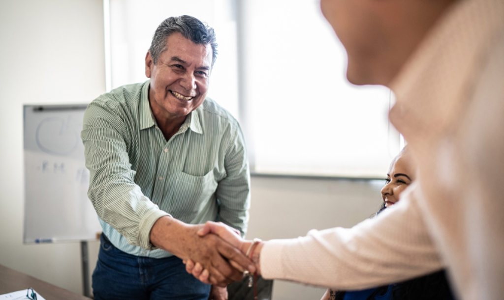 Business Owner Handshake This image depicts a business owner shaking hands with a client.