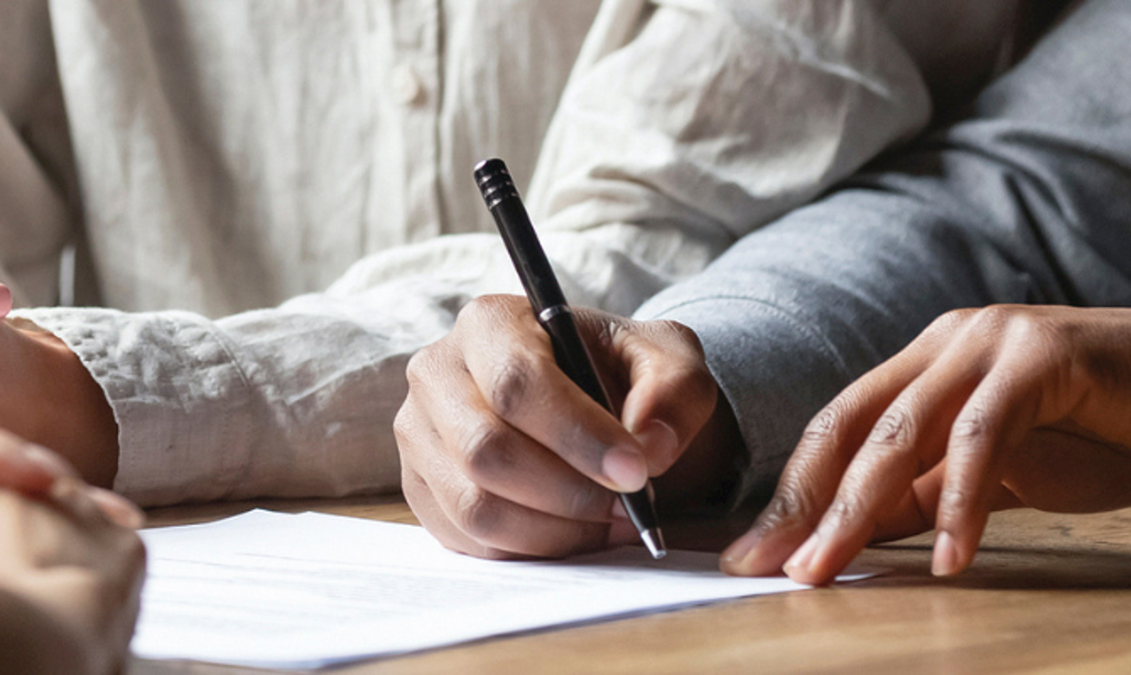 open an account header man signing paper with pen