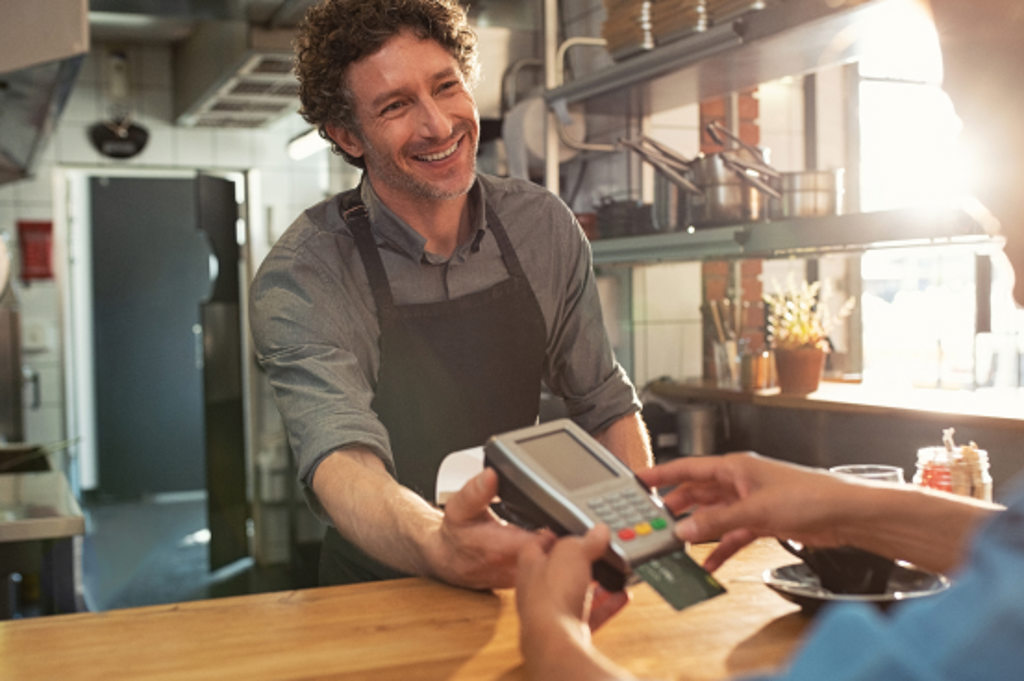 clerk checking out debit card